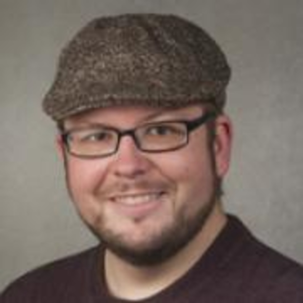photo of Adam Skibbe with a flat cap